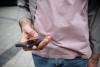 Man holding a mobile phone in his hand