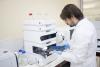 Man in laboratory carrying out liquid chromotography-masse spectrometer